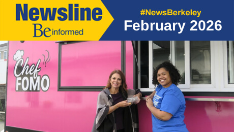 Two women stand in front of a pink food truck, smiling and enjoying the vibrant atmosphere of the food scene.